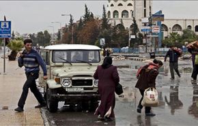 عودة اللاجئين الى اليرموك رغم الاشتباكات المتقطعة