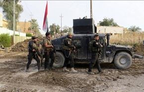 علم العراق فوق كلية زراعة الرمادي بعد تحريرها