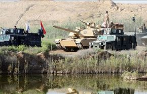 رفع العلم العراقي فوق جسر ناحية الكرمة شمال الفلوجة