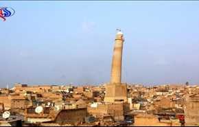 المنارة الحدباء تترنح وسط القذائف والصواريخ في أيمن الموصل+فيديو