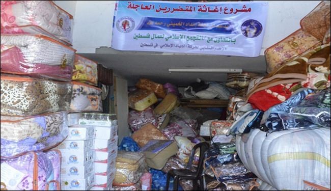 بالصور..مساعدات لجنة الامام الخميني للاغاثة للأسر بغزة