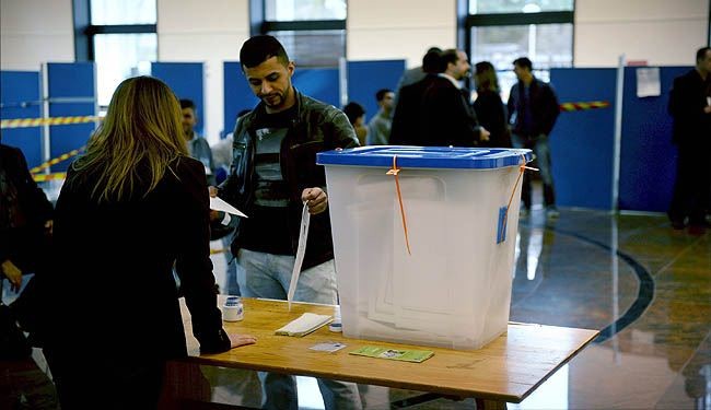 إقبال كثيف على الاقتراع ومنافسة كبيرة بين قوى العراق السياسية
