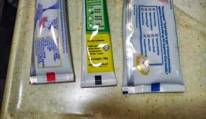 ماذا يعني اللون في أسفل أنبوب معجون الأسنان