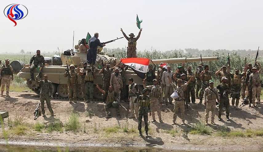 العلم العراقي يرفرف على سجن بادوش بعد تحريره