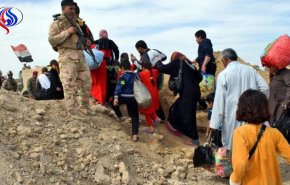 اجلاء 300 عائلة من القائم عبر ممرات مؤمنة من الحشد الشعبي

