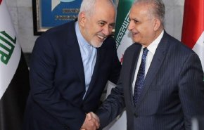 ظريف والحكيم يؤكدان ضرورة تعزيز التعاون لتخفيف التوتر في المنطقة