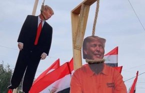 شاهد بالصور... العراقيون يعدمون ترامب في شوارع بغداد