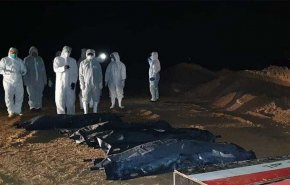 الحشد الشعبي يباشر بدفن جثامين ضحايا كورونا في النجف الأشرف 