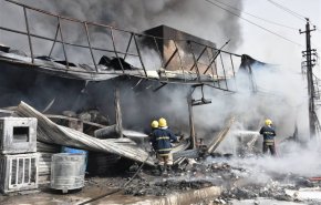 بالصور..50 فرقة تشارك في اخماد حريق كرادة ببغداد