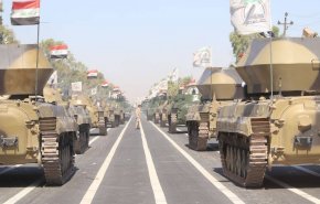من هم المقاتلون الذين كانوا في استعراض الحشد الشعبي؟