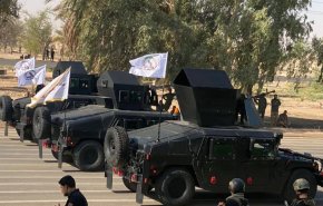 بالفيديو والصور..الحشد الشعبي يجري استعراضا عسكريا