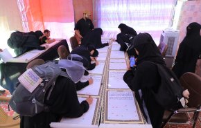 ضمن فعاليات زيارة الأربعين.. خط أطول مصحف بأيدي الزائرين
