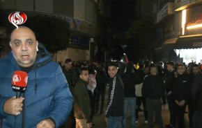 مسيرة دعم لغزة في رام الله في ساعة تحويل العام الجديد 