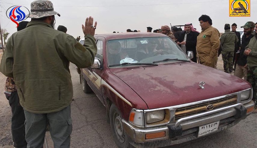بالصور: الحشد الشعبي يشرف علی عودة النازحين الی الشرقاط