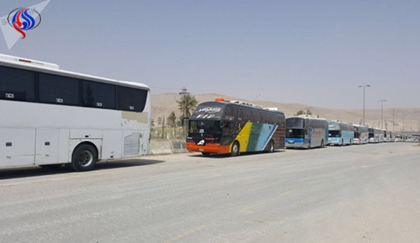 هذه هي نقطة استلام وتسليم المسلحين الخارجين من حرستا إلى إدلب