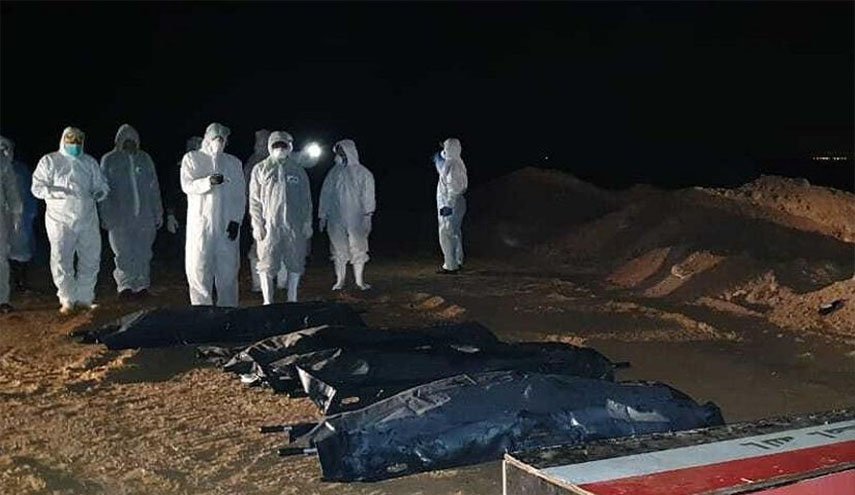 الحشد الشعبي يباشر بدفن جثامين ضحايا كورونا في النجف الأشرف 