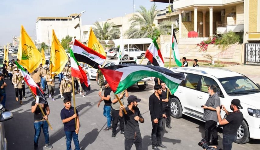 النجباء يرفعون اعلام الدفاع عن فلسطين في كل انحاء العراق 