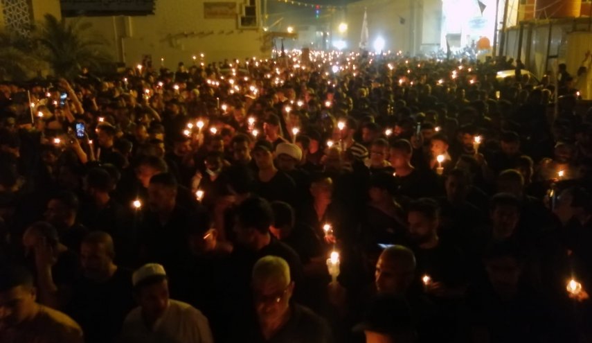 مسيرة الشموع بذكرى استشهاد السيد الصدر ونجليه +صور