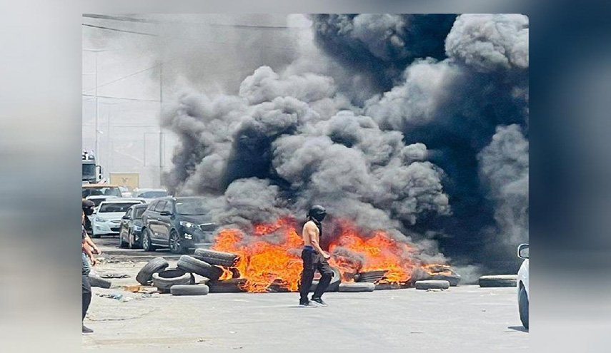 اشتباك مسلّح في جنين.. ومستوطنون يضرمون النار في أراضي بالخليل