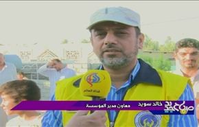 توزیع مساعدات مؤسسة الامام الخمیني علی النازحین العراقيين في النجف