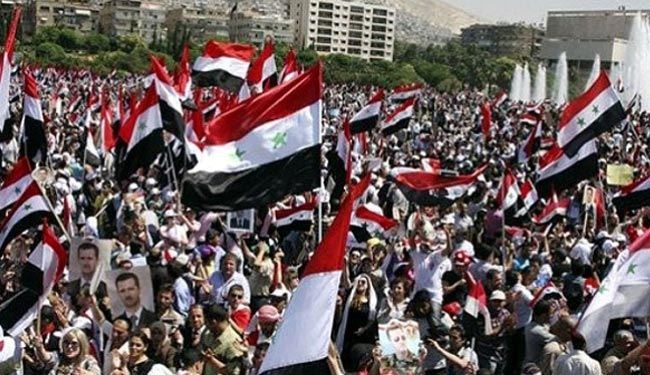 مردم شهر حلب در حمايت از اسد راهپيمايي كردند