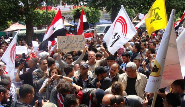 احتجاجات بتونس تطالب بإعادة العلاقات مع سوريا