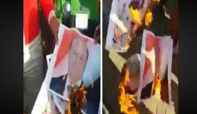 الجنوبيون يحرقون صور الهارب هادي ونائبه بعدن