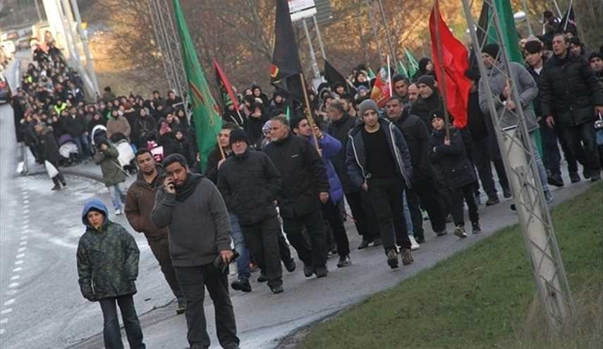 بالصور ..مسيرة لأربعينية الامام الحسين (ع) في احياء العاصمة السويدية
