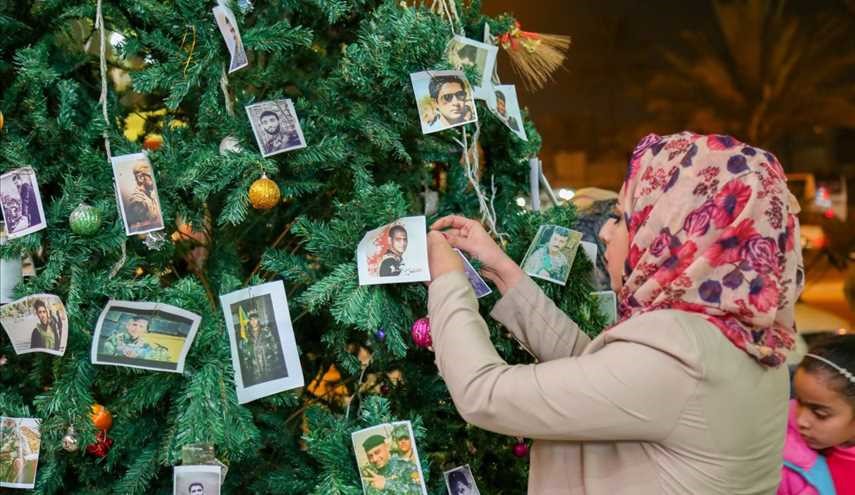 صور شهداء القوات العراقية تزين شجرة عيد ميلاد السيد المسيح (ع)