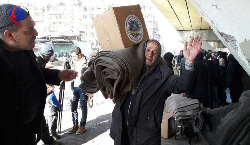 بالصور.. مساعدات إغاثية إيرانية لـ500 عائلة في حي الشعار بحلب