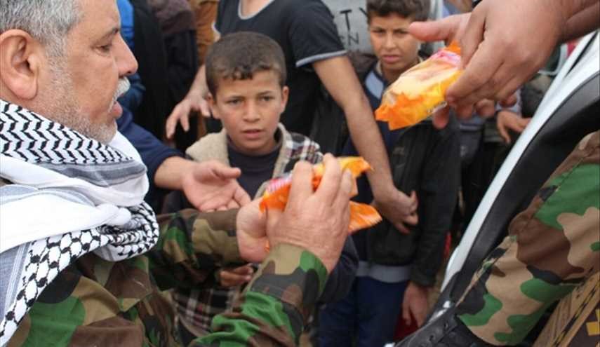 بالصور...قافلة أهالي البصرة العراقية  لإغاثة النازحين من الموصل في مخيم الجدعة