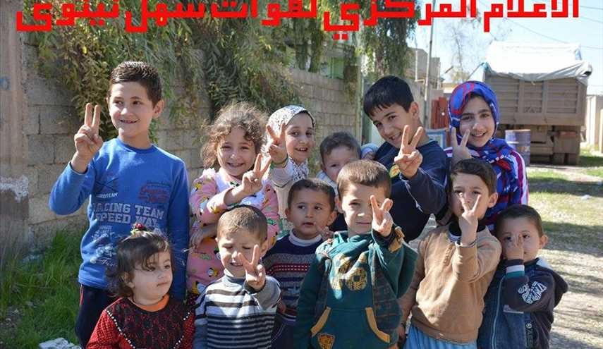 بالصور لواء 30 يساعد عودة عوائل الشبك إلى ديارهم في سهل نينوى
