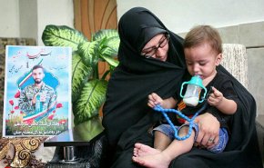 واکنش همسر شهید محسن حججی به خبر بازگشت پیکر شهید+ تصویر