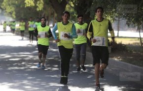 بالصور: 1400 متسابق في ماراثون 
