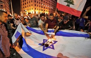 آتش‌زدن دوباره پرچم رژیم صهیونیستی در تظاهرات لبنان + عکس