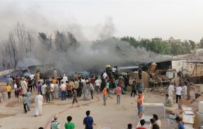 بالصور.. السيطرة على حريق هائل في سوق العسكري بالنجف الاشرف
