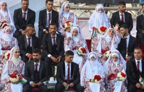 عقدکنان ده‌ها زوج در غزه؛ بمب‌ها هم حریف بله گفتن نشدند+فیلم

