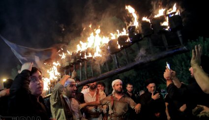 آیین مشعل گردانی در قم و تهران