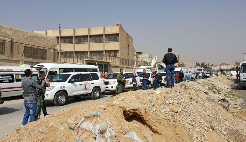 قافلة الصليب الاحمر تدخل الغوطة وتتجه الى دوما