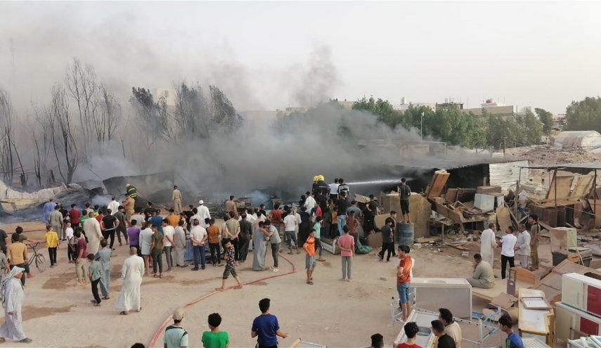 بالصور.. السيطرة على حريق هائل في سوق العسكري بالنجف الاشرف
