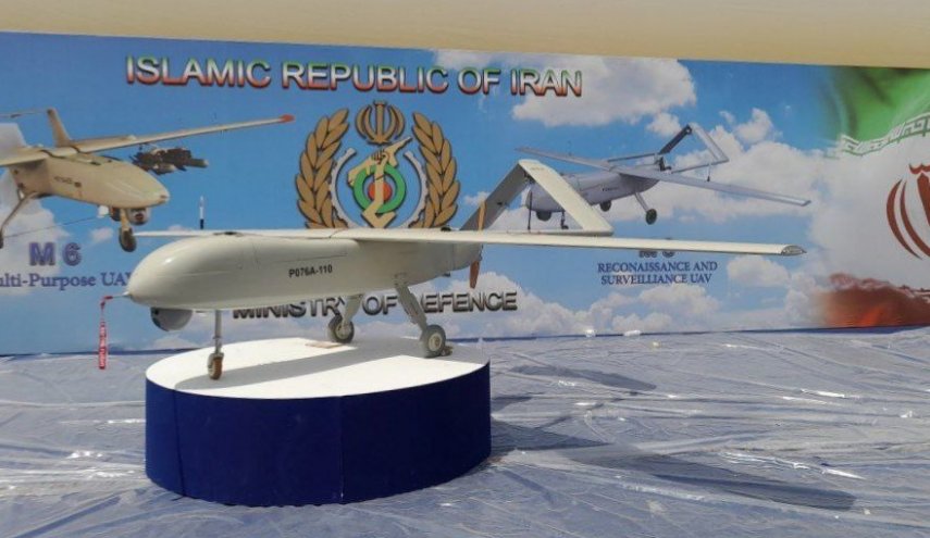  بالصور.. عرض طائرة مهاجر 8 الإيرانية في معرض بغداد